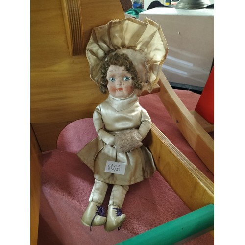 862A - Antique doll with original gold satin clothing.