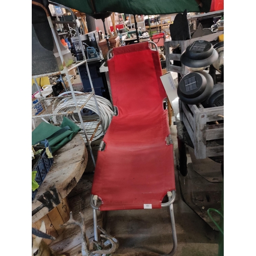 383 - RED FOLD OUT METAL LOUNGER BED OR CHAIR