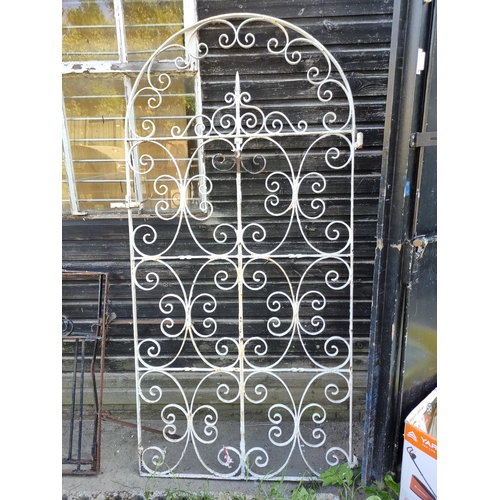 660 - Wrought iron arched scroll detailed metal gate