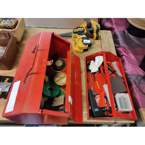 691 - RED METAL TOOL BOX WITH MIXED ITEMS INCLUDING ELECTRICIANS TAPE