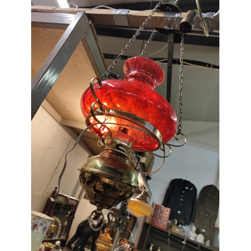 1208 - Stunning brass ceiling light with red glass shade