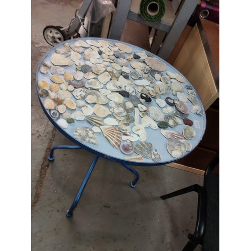 493A - Heavy metal Shell topped Bistro table.