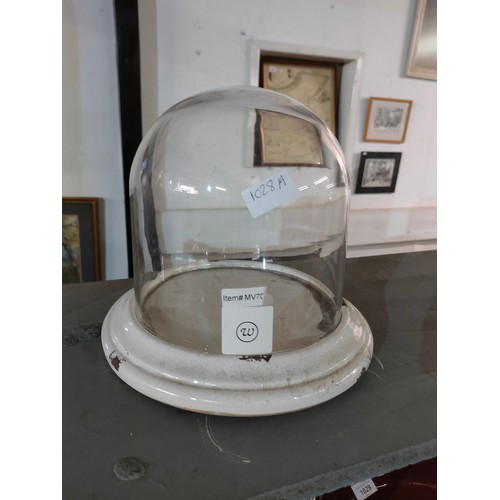 1028A - Small glass dome cloche on white enamel base, 25cm x 20cm.