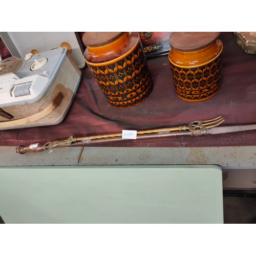 1628A - Vintage copper and brass toasting fork and a vitange brass poker.