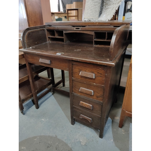 1657 - Antique roll top desk with 5 drawers and compartments.
92 w x 100 h cm.