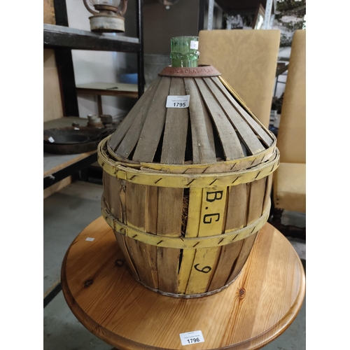 1795 - A very large French wine bottle in a slatted wooden housing with a metal collar. Fabulous potential ... 