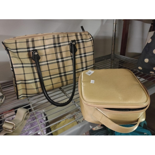 394 - BRAND NEW gold make-up travel bag and Burberry style hand bag.