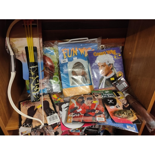 456 - A great selection of wigs, a bow and arrow and pirate accessories