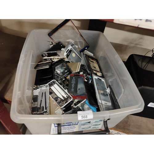 568 - Collection of mobile phone parts including screens, batteries etc.