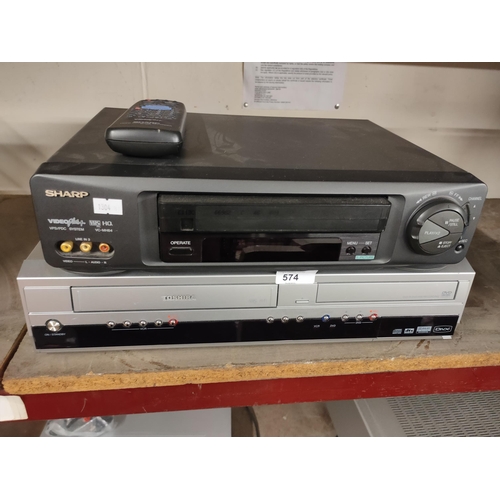 574 - Sharp videoplus VHS player model No. VC-MH64HM and a Toshiba  DVD video recorder/video cassette reco... 