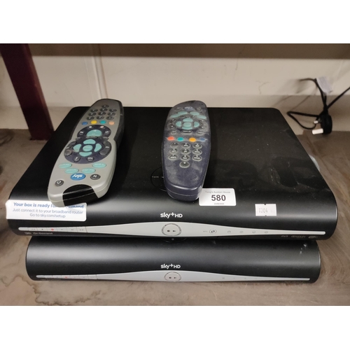 580 - Two sky+HD satalite boxes and two remote controls.