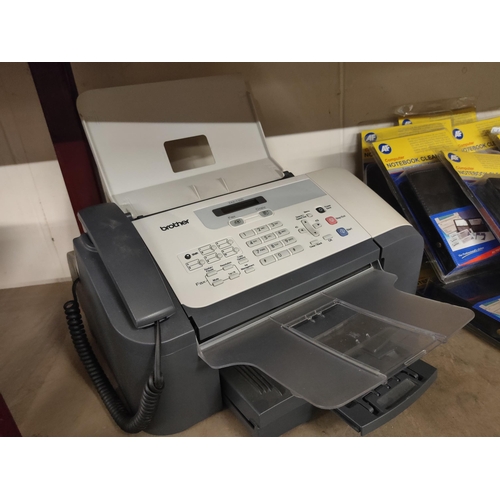 593 - Brother fax-1360 plain paper fax machine and telephone.