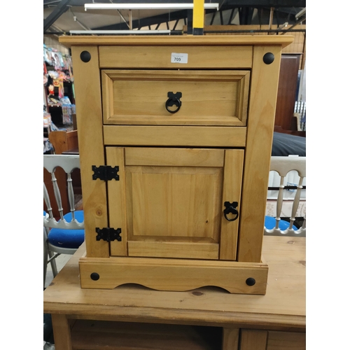 709 - Really decorative storage cupboard with drawer. With carved wood detail. A real quality piece