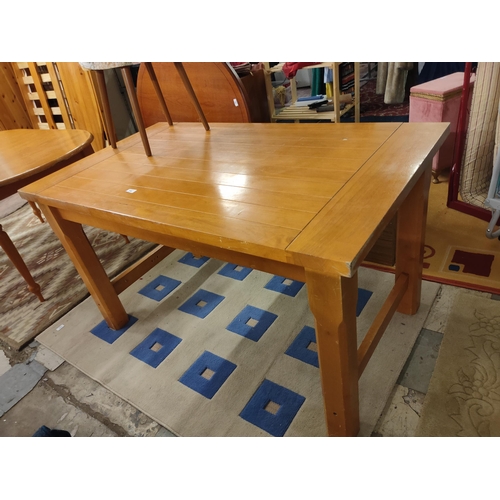 718 - Large pine kitchen table measures 140 x 81 cm.