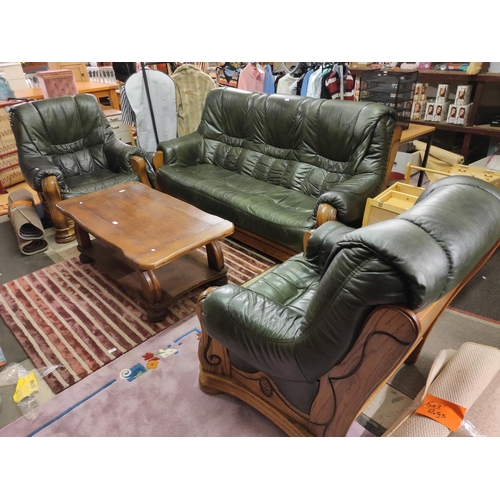 733 - Stunning wood and green leather three piece suit, comprising of two arm chairs and a three seater.