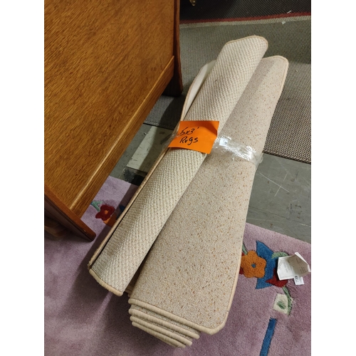 740 - Three 5' x 3' beige rugs.