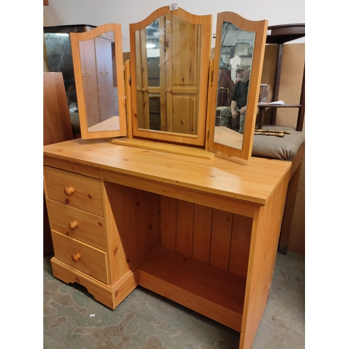 753 - Pine dressing table with 3 drawers and tri fold mirror.