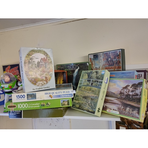 129 - Huge selection of jigsaw puzzles including some lovely scenic designs