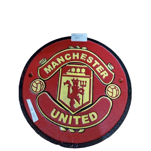 40 - Heavy metal wall plaque with the Manchester United Logo. Diameter approx 9.5 inches