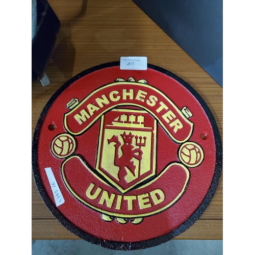 40 - Heavy metal wall plaque with the Manchester United Logo. Diameter approx 9.5 inches