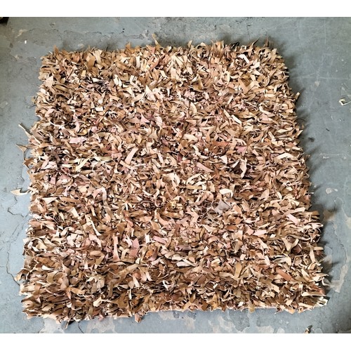 395 - Tan leather rag roll rug, approx 120 x 120cm