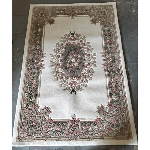 399 - Classic 100% wood rug, with a beautiful cream, rose and green pattern. Approx 180 x 120cm