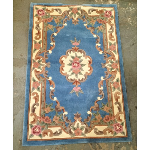 401 - Classic Persian style rug in blue, rose and cream. Lovely condition. Approx 180 x 120cm