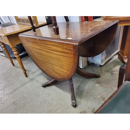 1204 - Stunning drop leaf dining table with claw feet.