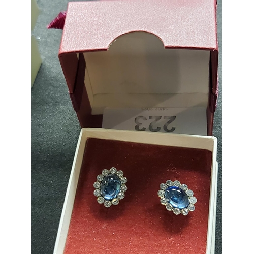 223 - Beautiful 9ct yellow gold earrings with oval blue  and clear stones