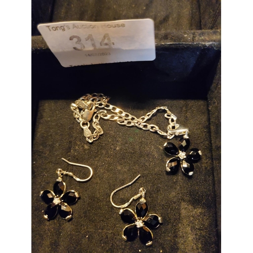 314 - Pretty 925 silver charm bracelet and earring set, with black onxy daisy charms