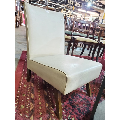 343 - 21st century nursing chair. Original chalk coloured leatherette upholstery with piping detail.
Lovel... 