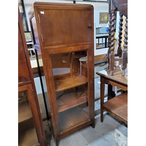 375 - Mahogany tall unit consisting of two cupboards. Top cupboard with internal shelf and bottom glass fr... 