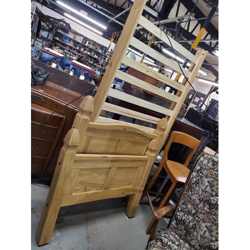 383 - Single pine slated base bed with solid wooden head and footboard. Height of headboard is 43.5 inches... 