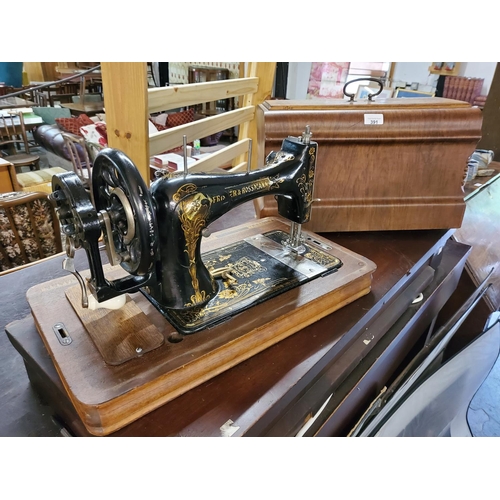 391 - Vintage sewing machine in wooden case