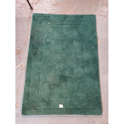 414 - Dark green handy little rug, approx 90 x 60cm