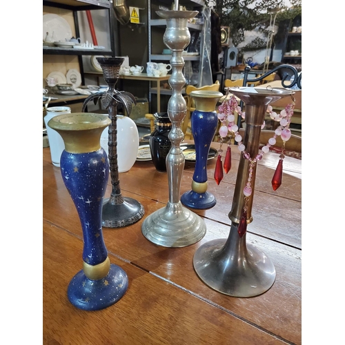 417 - Rather funky selection of candlesticks in wood or metal, includes a lovely palm tree