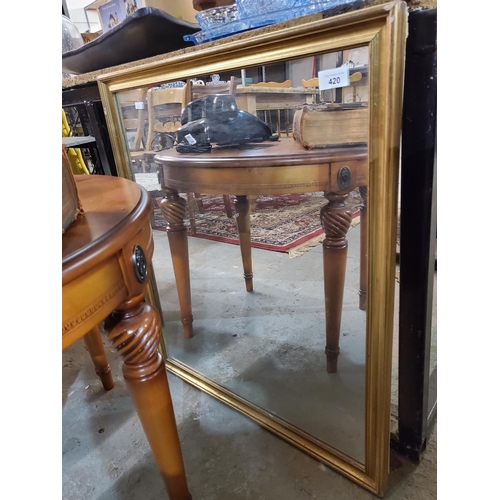 420 - A large wooden framed mirror