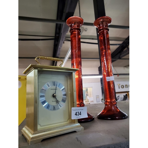 434 - A lovely mixed lot of a beautiful gold coloured battery operated mantle clock and 2  tall red glass ... 