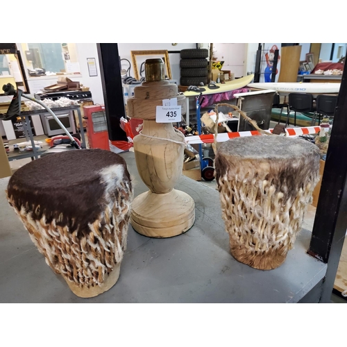 435 - 2 animal skin covered tomtom drums and a wooden table lamp base