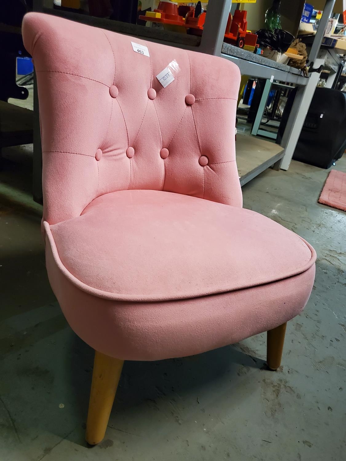 A cute child size pink plush bedroom chair in very good condition