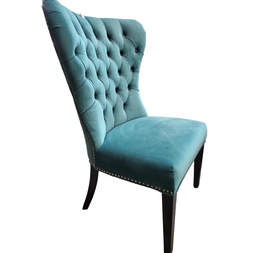 333 - Deep button wingback lounge chair.
Colour - sea green. 
Fabric - velvet.
Dark wood legs, brushed chr... 