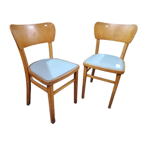 373 - A pair of 1970s kitchen chairs, upholstered with turquoise vinyl. 
Size in inches 31 (H) x 16 (D) x ... 