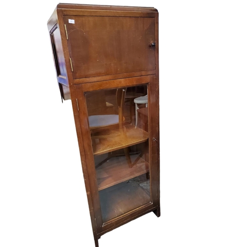 375 - Mahogany tall unit consisting of two cupboards. Top cupboard with internal shelf and bottom glass fr... 