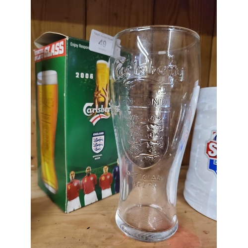 49 - Carlsberg official 2006 pint glass with embossed Three Lions logo,