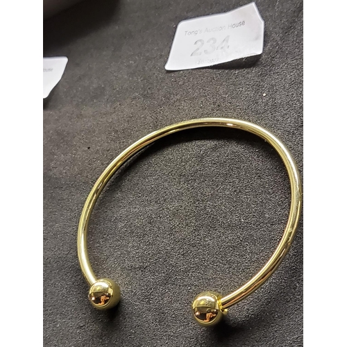 234 - Yellow metal torque bangle