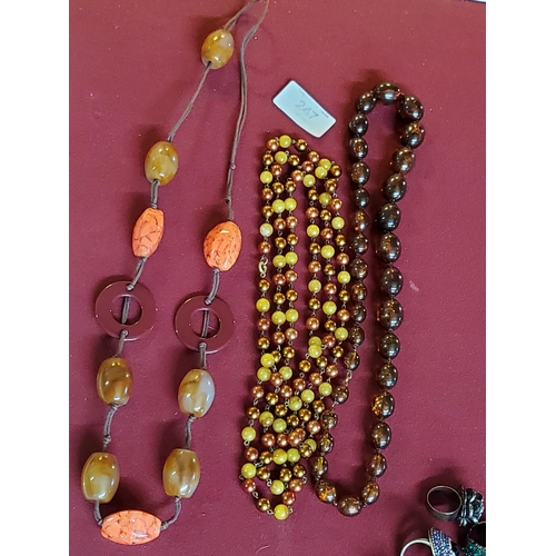 247 - 3 beautiful amber colour necklaces