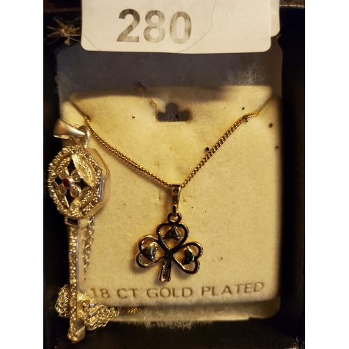 280 - 2 really pretty necklaces, one gold plated in the shape of a shamrock and the other a silver coloure... 