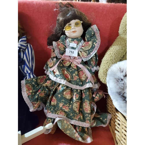 752 - Lovely collectable doll on stand.