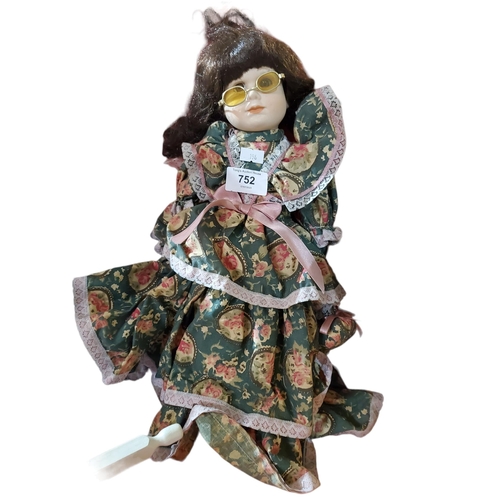 752 - Lovely collectable doll on stand.