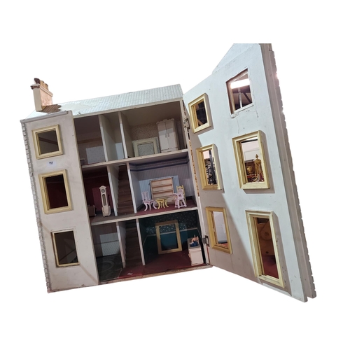 763 - Large wooden three LEVEL dolls house with wooden furniture, 61 x 32 x 74 cm approx.